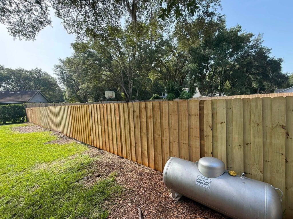 Pressure treated wood fence installed by Elite Fence Systems